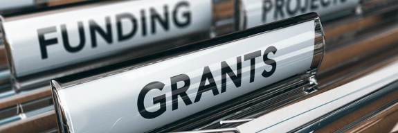 Hanging file folders titled funding, grants and projects.